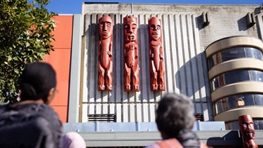 Carved panels on the outside of the council building.