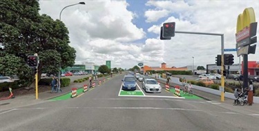 Cycleway on each side of the road, with bikers travelling in the direction of traffic