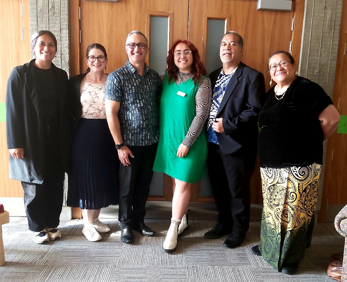 Group photo of pasifika reference group members in front of the council chamber