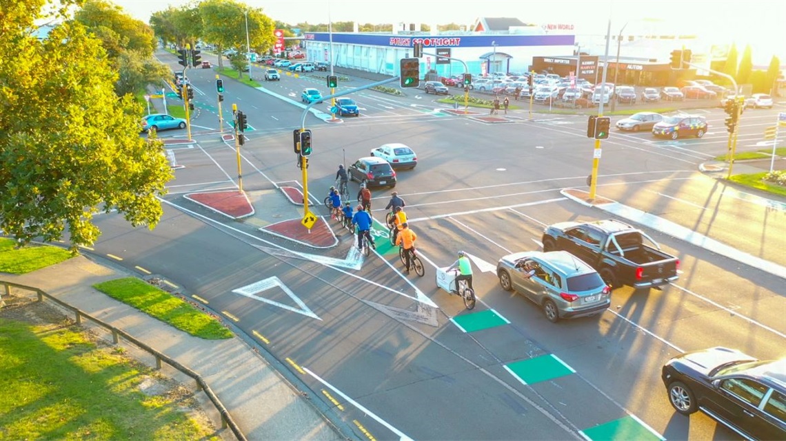 All kinds of traffic flowing freely through a busy intersection.