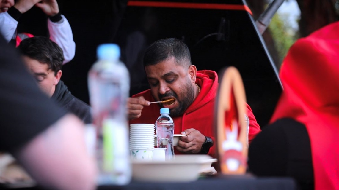 Contestants in the last curry comp battling it out to see who can take the heat.