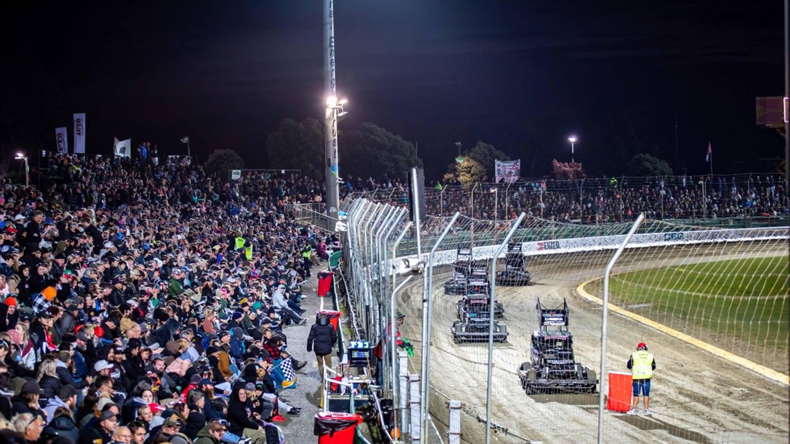 A packed crowd of people glued to the on-track thrills of the SuperStock Teams Champs.