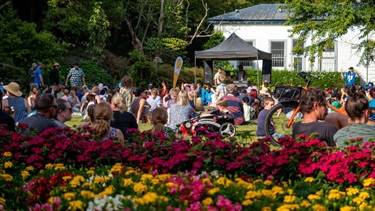 A riot of colourful blooms surround families at a summer reading event in the Esplanade.