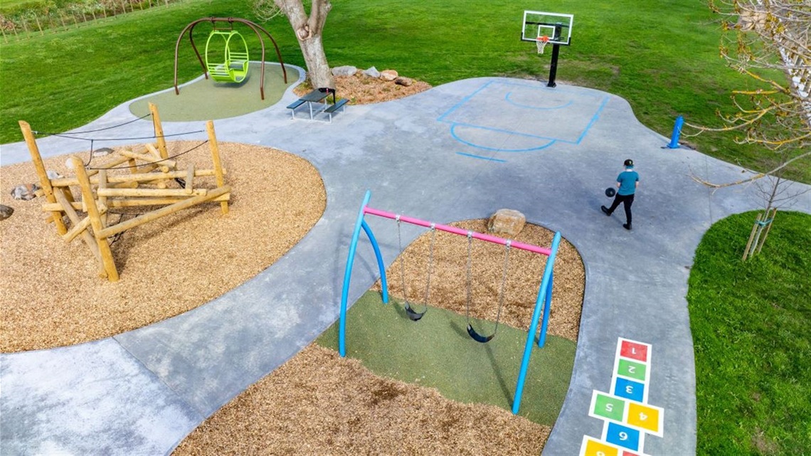 New playground with accessible swing shot from above.