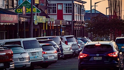 Carparks along Cuba Street filled to capacity at dusk.