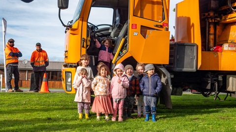 Kindy kids smiling at a visit from our recycling trucks.